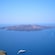 Boats navigate toward the Greek island of Santorini